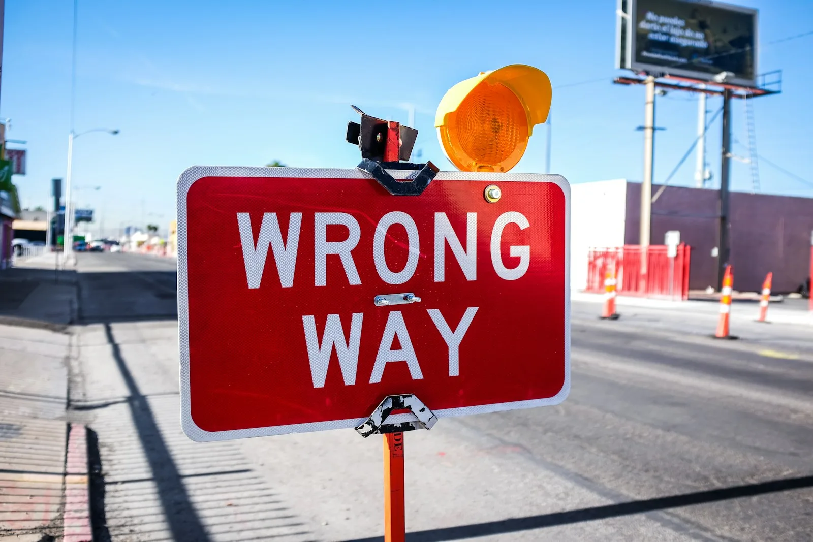 A road sign stating “Wrong Way”