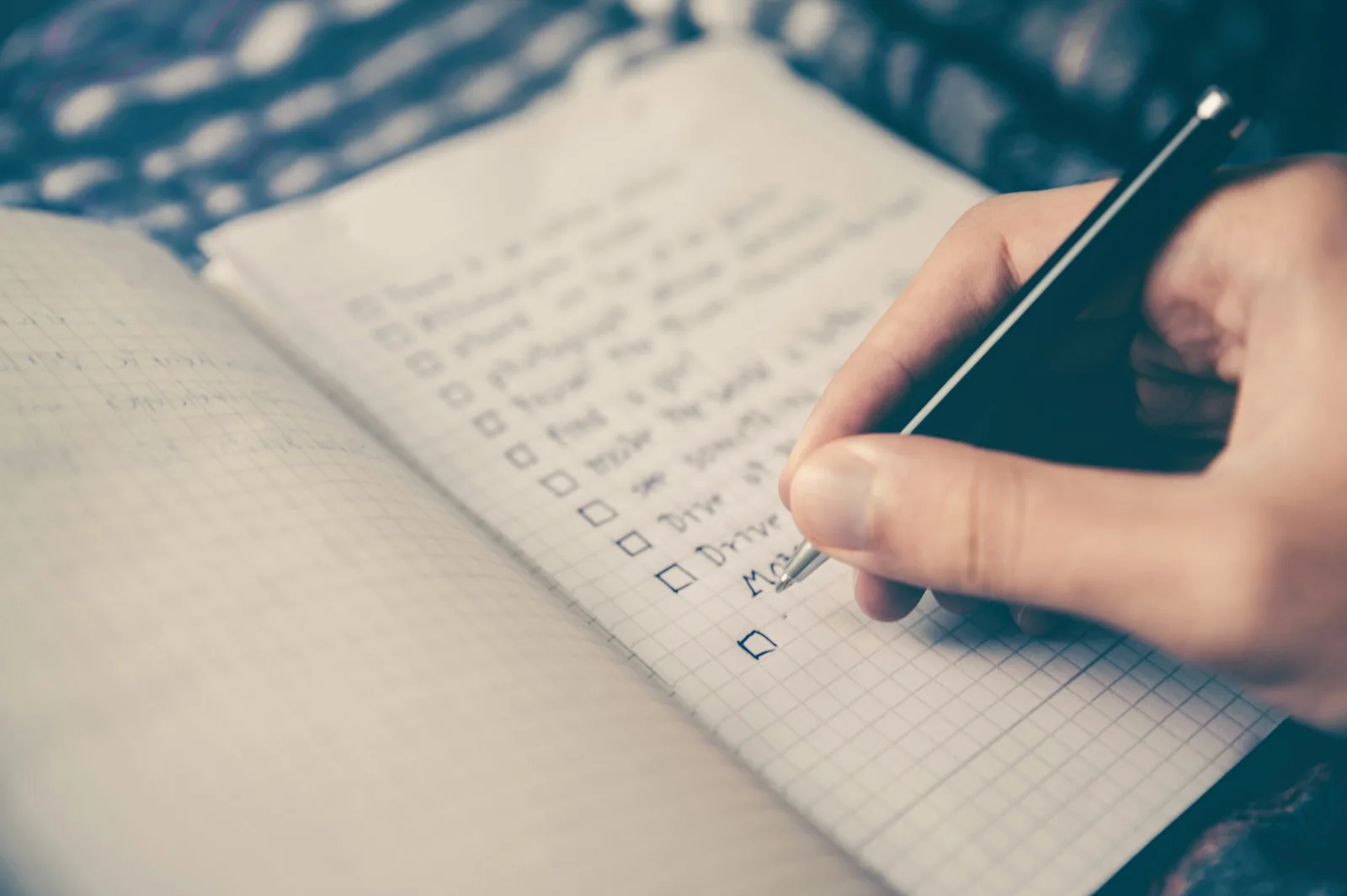 Image of a person creating an actionable plan for understanding their financial situation