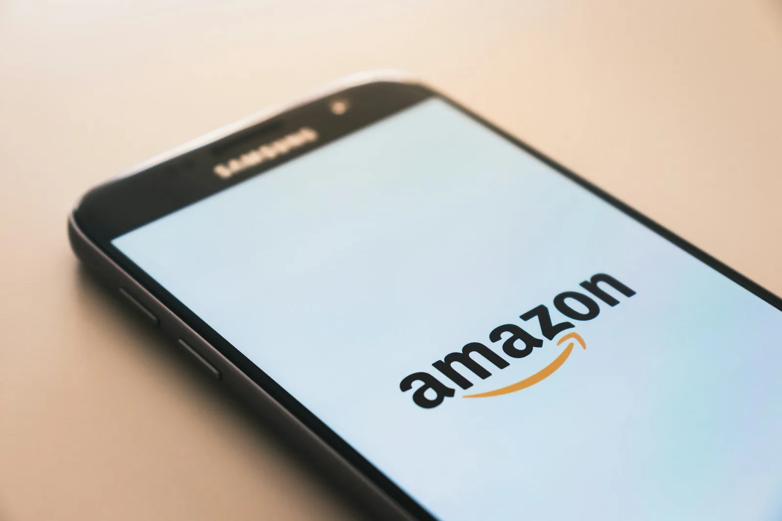 Image of a mobile phone showing the logo of Amazon