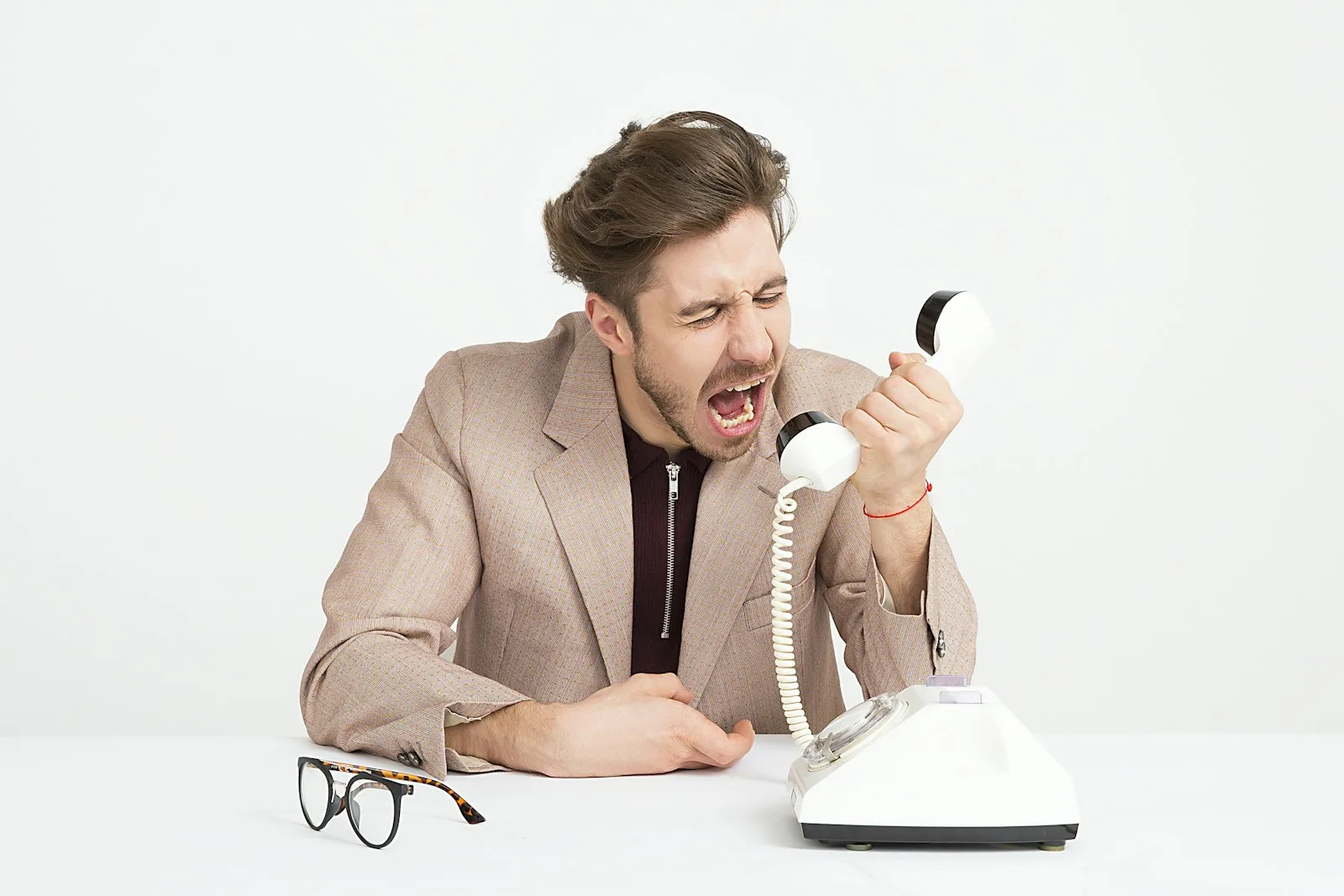 Image of a frustrated person ignoring the call of a creditor