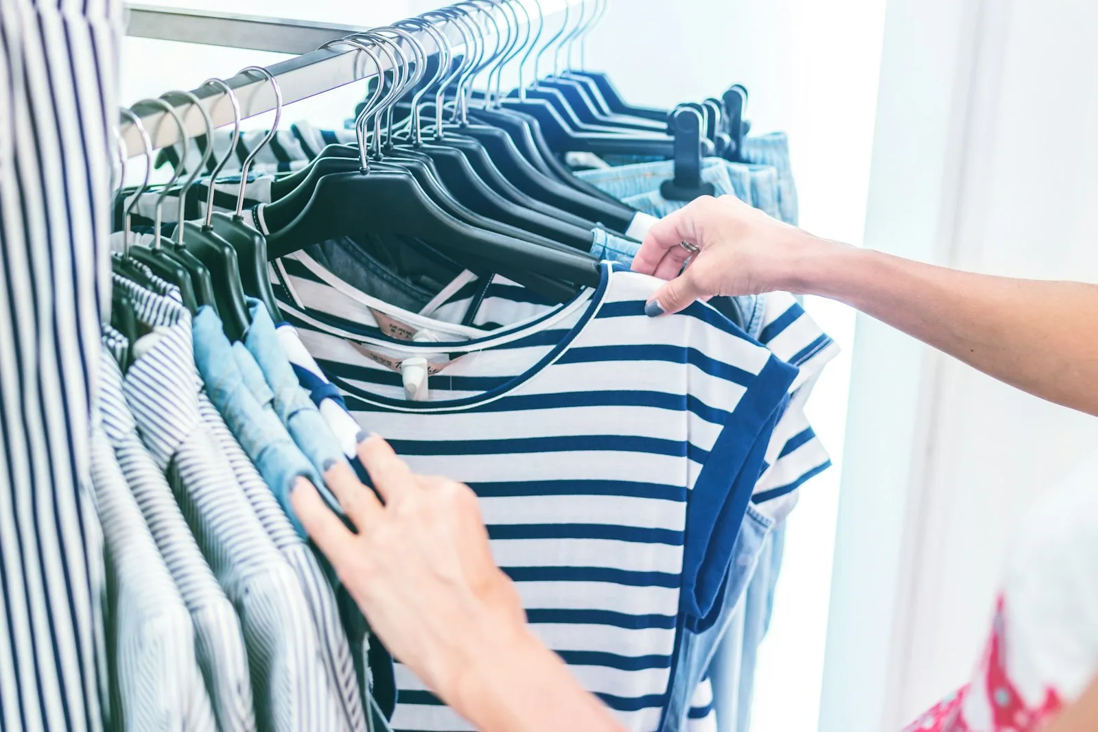 Photo of a person checking carefully before making a purchase. A sign of living frugal to minimise expense