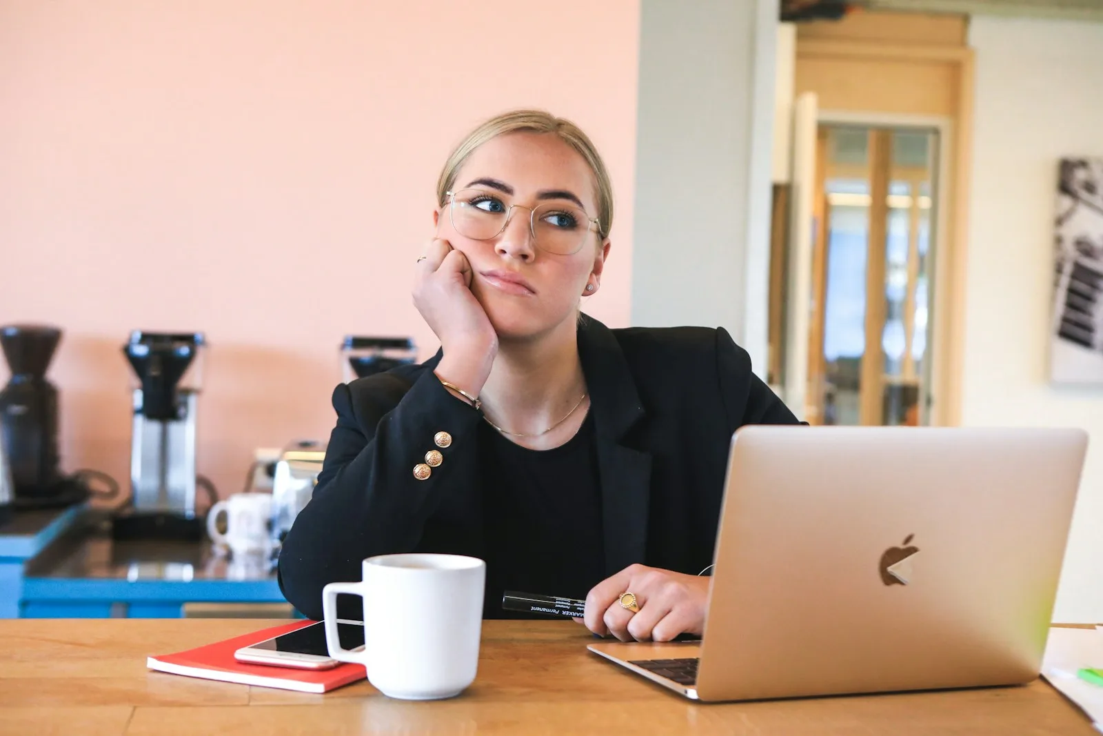 Photo of a person who is procrastinating from work. One of the major emotional barrier to break through while dealing with debt.