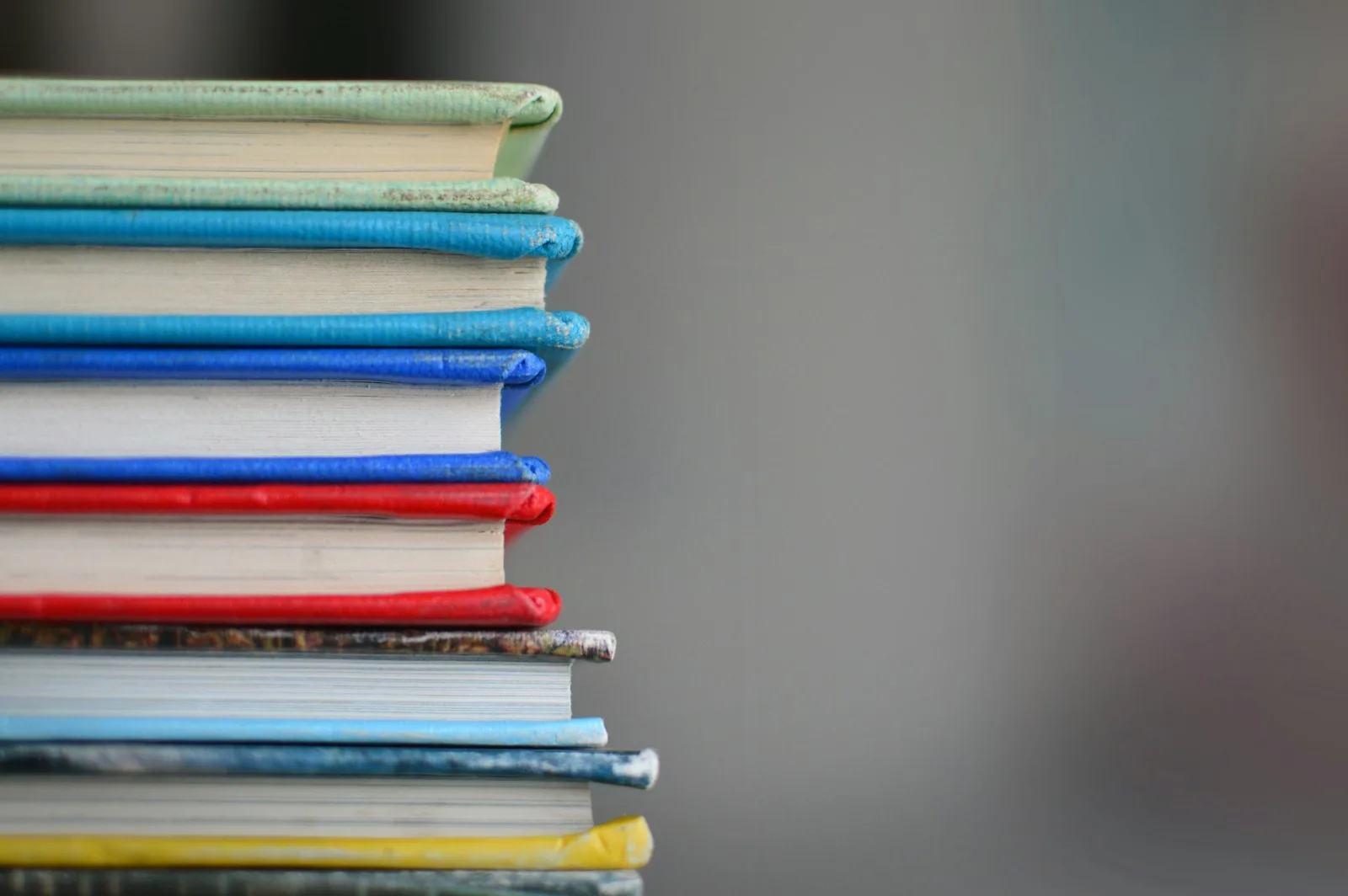 Photo of multiple books stacked one over the other