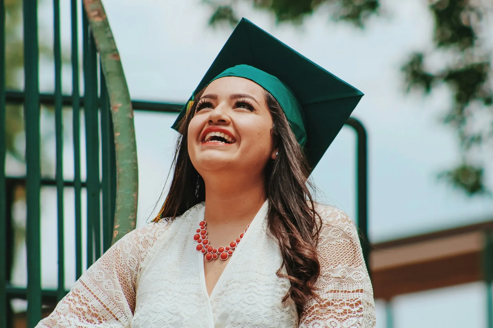 A college student looking happy post graduation and overcoming all financial challenges.
