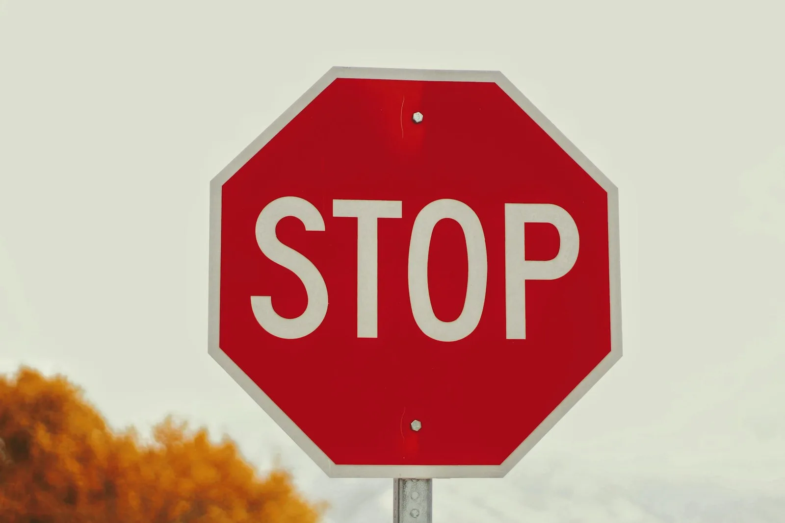 Photo of a stop sign on the road stating the limit on road. Similar to how we need to know the limit on our credit cards.