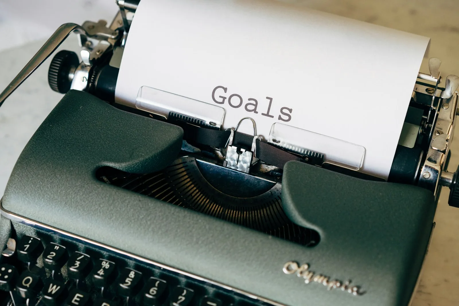 A typewriter printing the word “Goals”