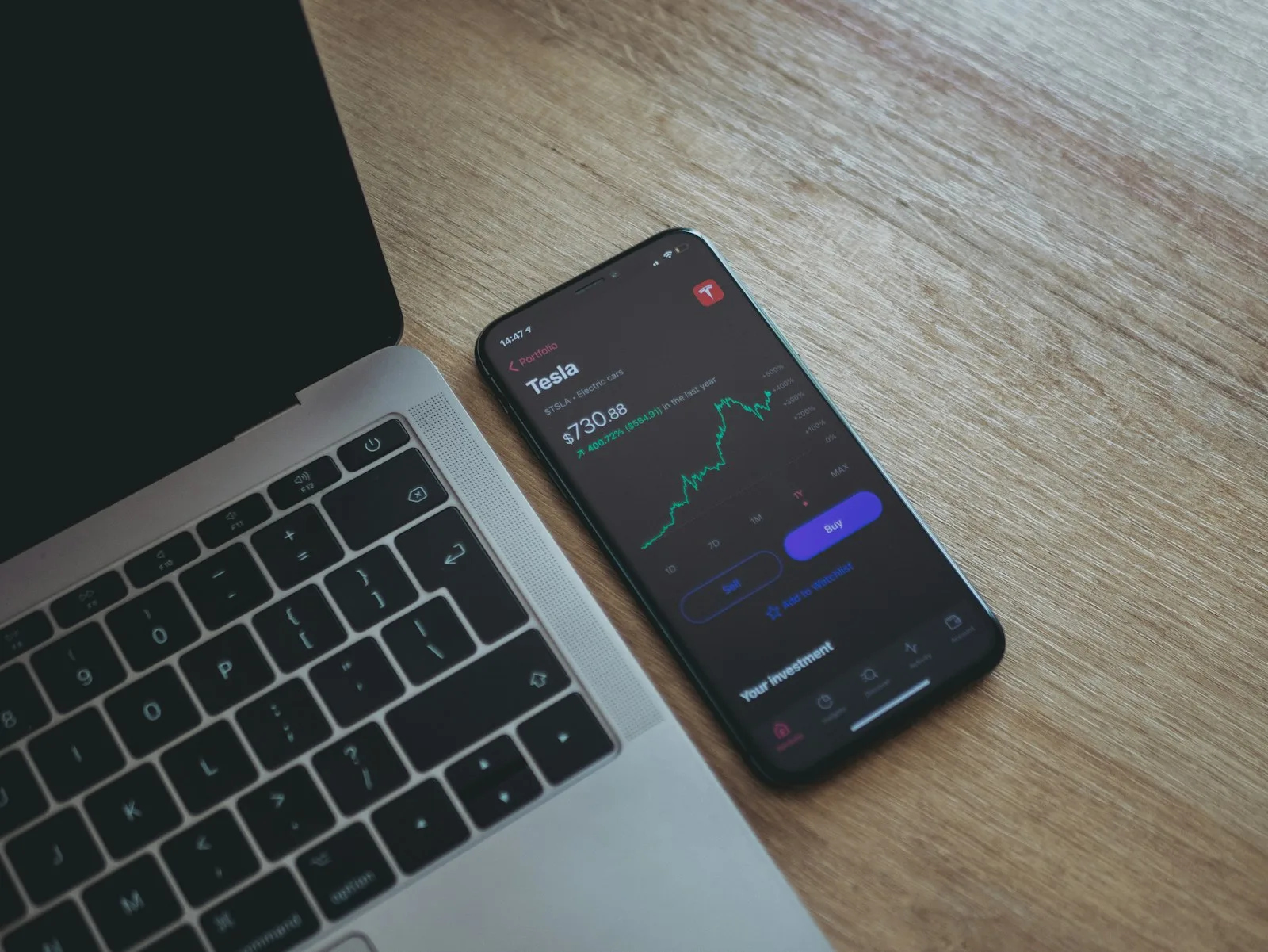A person checking their investment status on a mobile phone application