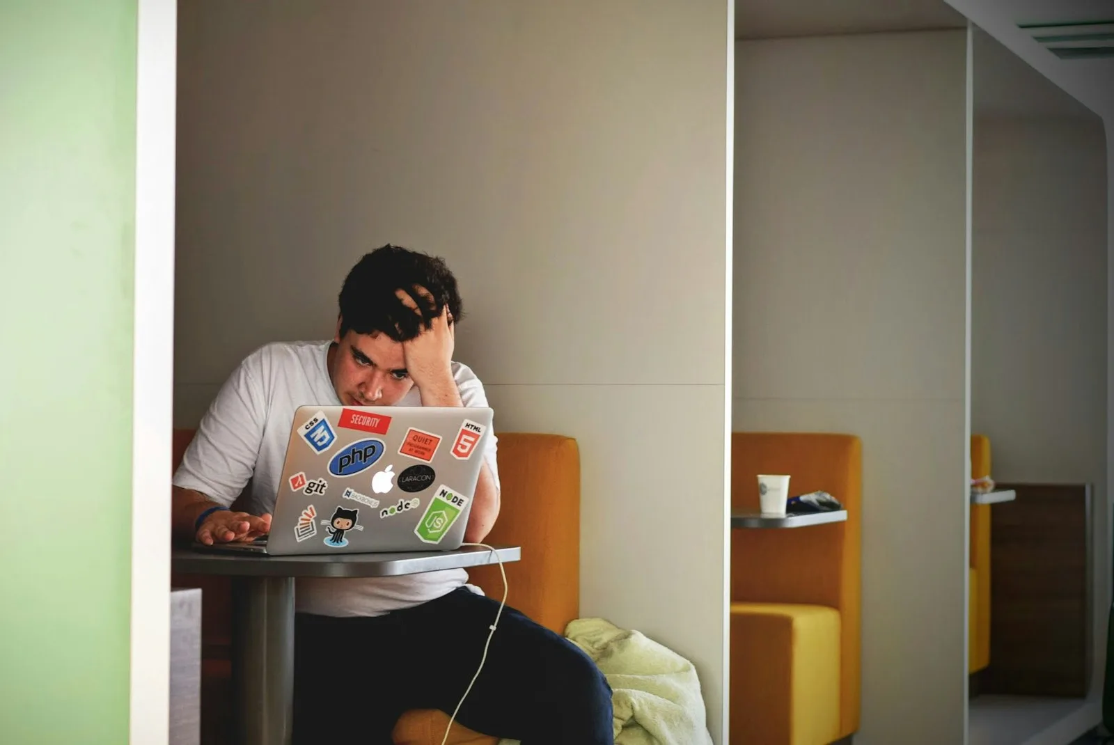 A student looking stressed after checking his student loans