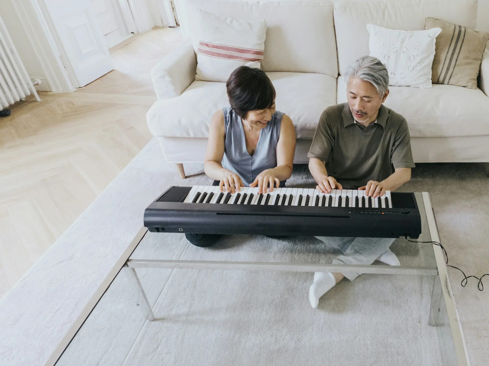 A couple enjoying their time over playing a musical instrument