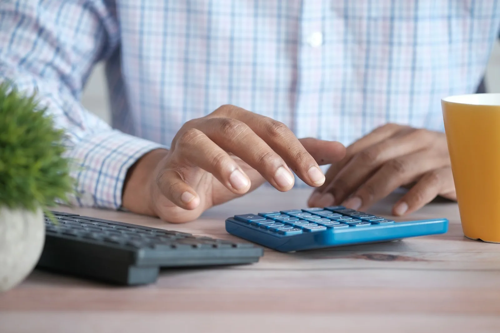 Photo of a person trying to calculate their tax implications for their investment profits