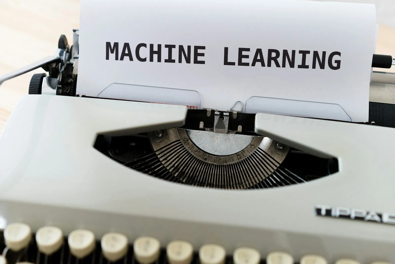 The words “MACHINE LEARNING” type written on a piece of paper